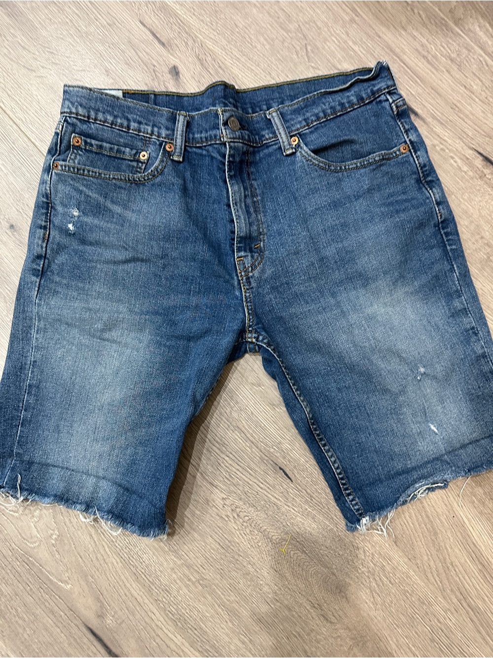 Levi's Distressed Dark Blue Denim Cutoff Shorts